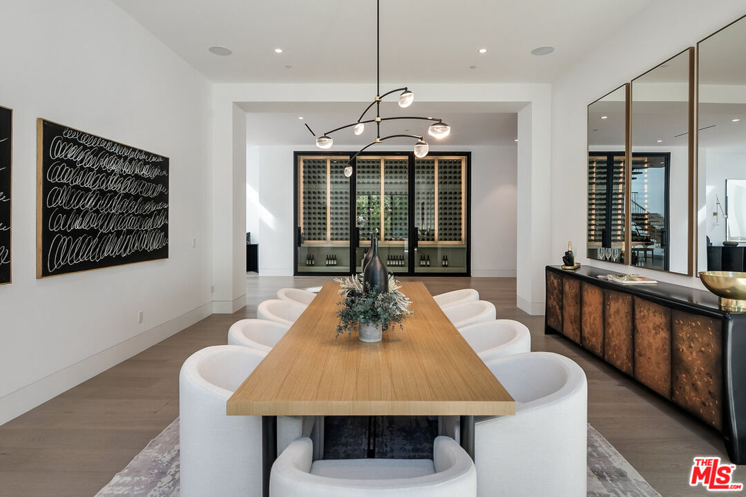 5376 Round Meadow Road Hidden Hills, CA 91302 - Photo 5 of 31 a view of a dining room with furniture window and wooden floor