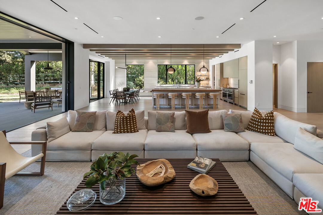 5376 Round Meadow Road Hidden Hills, CA 91302 - Photo 6 of 31 a living room with furniture and a large window