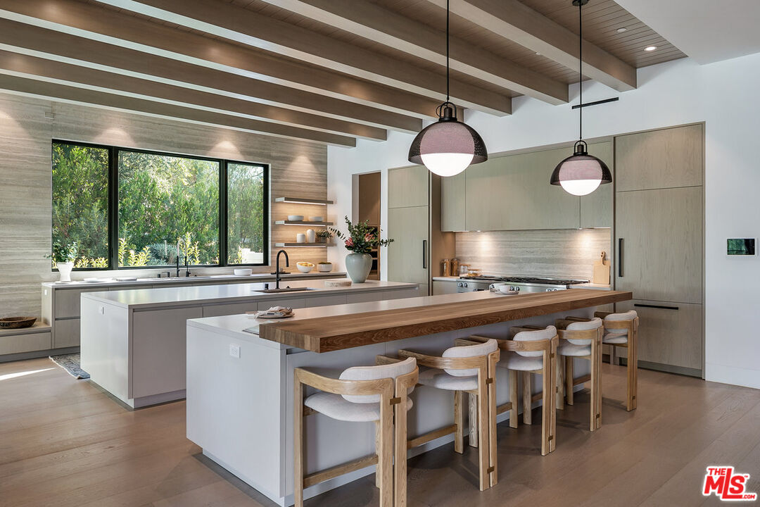 5376 Round Meadow Road Hidden Hills, CA 91302 - Photo 8 of 31 a kitchen with a table and chairs in it