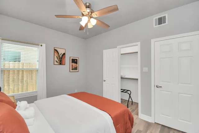 a bedroom with a bed and a window