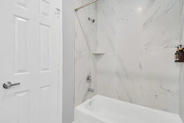 a bathroom with a white bath tub