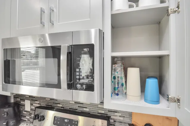 a kitchen with a sink and cabinets