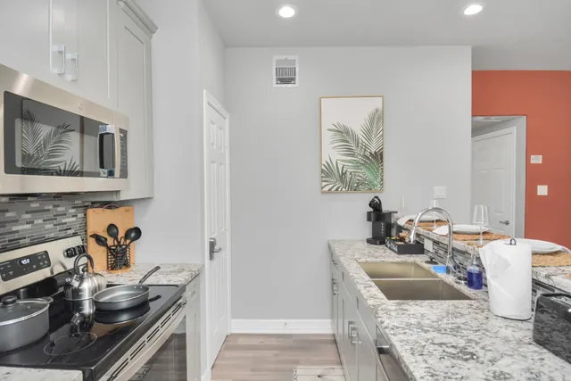 a kitchen with a stove and a sink