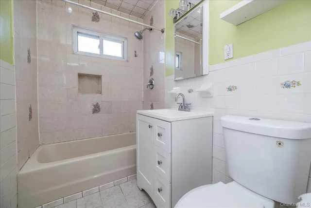 a bathroom with a sink toilet and bathtub