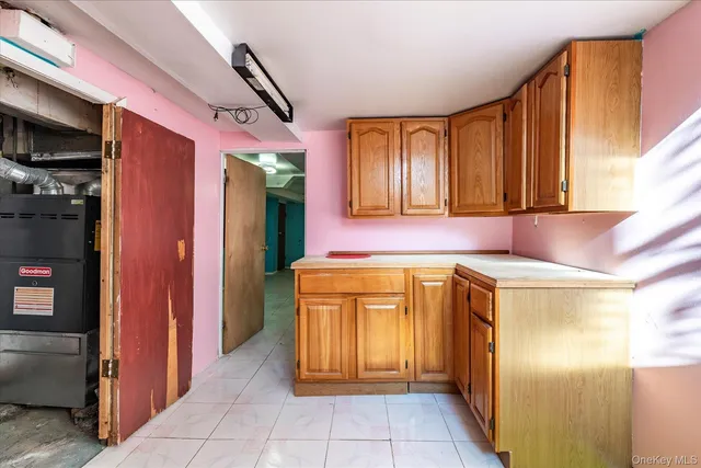 a kitchen with a refrigerator and cabinets