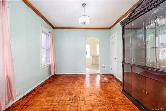 a view of a room with window and wooden floor
