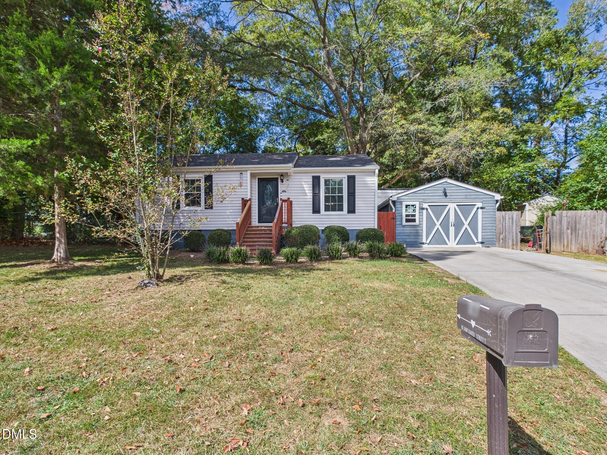 109 Blanchard Street Raleigh, NC 27603 - Photo 1 of 57 a front view of a house with garden
