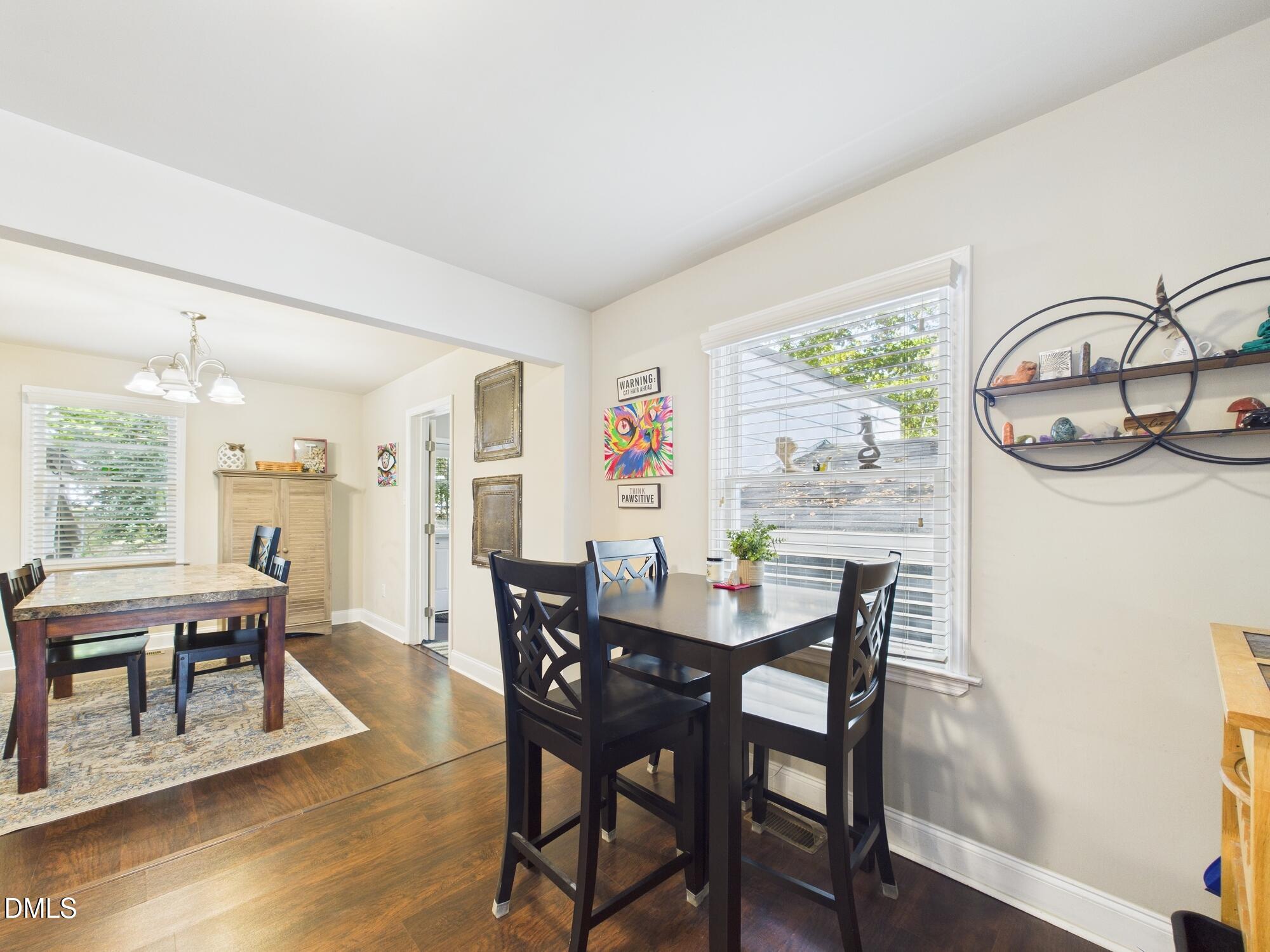 109 Blanchard Street Raleigh, NC 27603 - Photo 12 of 57 a view of a dining room with furniture and wooden floor
