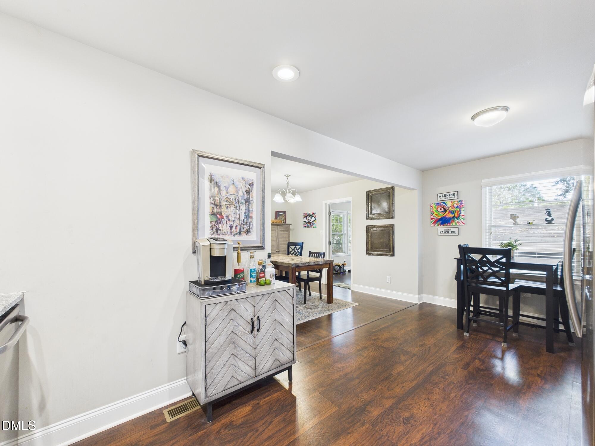109 Blanchard Street Raleigh, NC 27603 - Photo 18 of 57 a living room with furniture and wooden floor