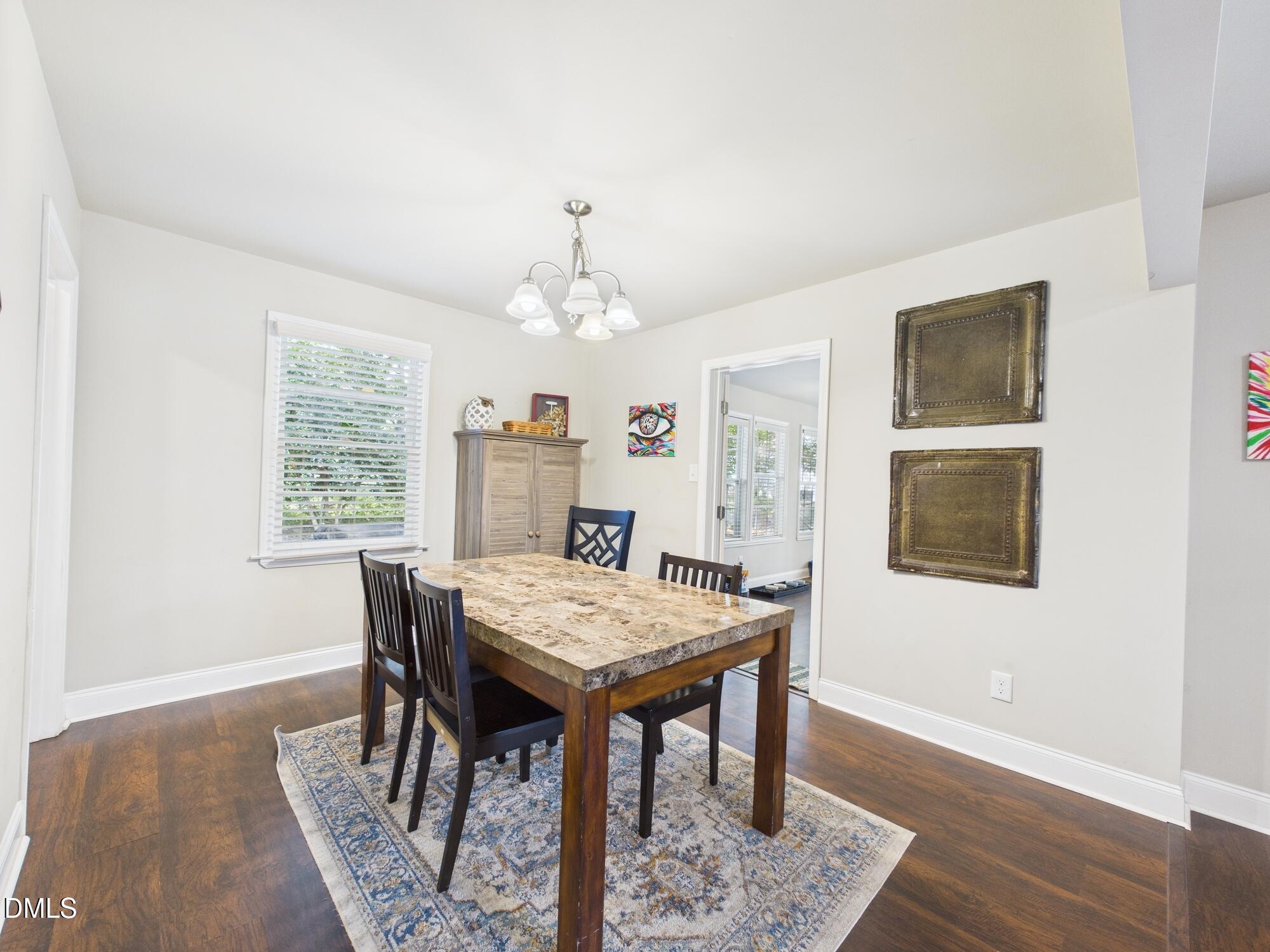 109 Blanchard Street Raleigh, NC 27603 - Photo 20 of 57 a view of a dining room with furniture window and wooden floor