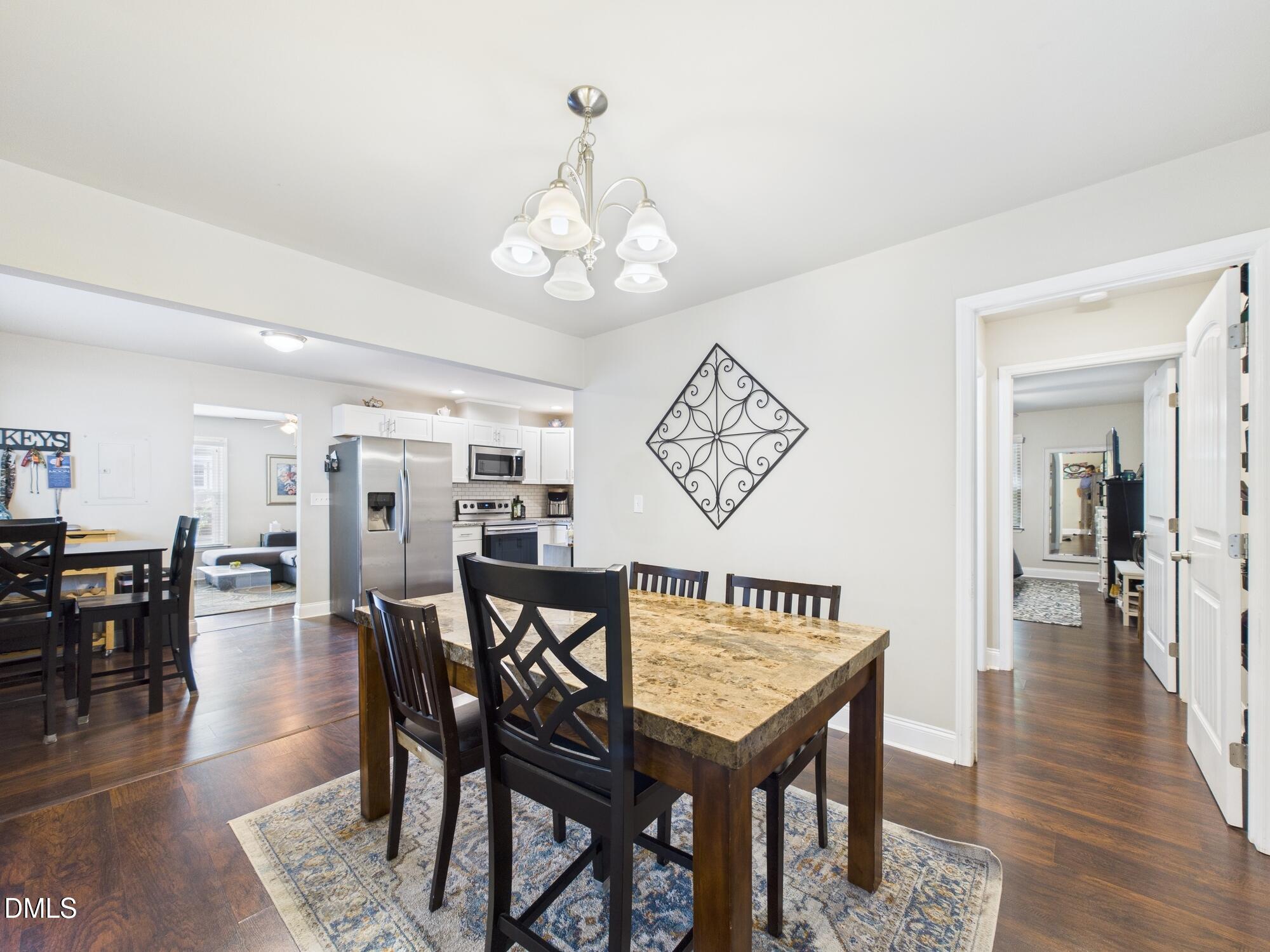 109 Blanchard Street Raleigh, NC 27603 - Photo 22 of 57 a view of a dining room with furniture and wooden floor