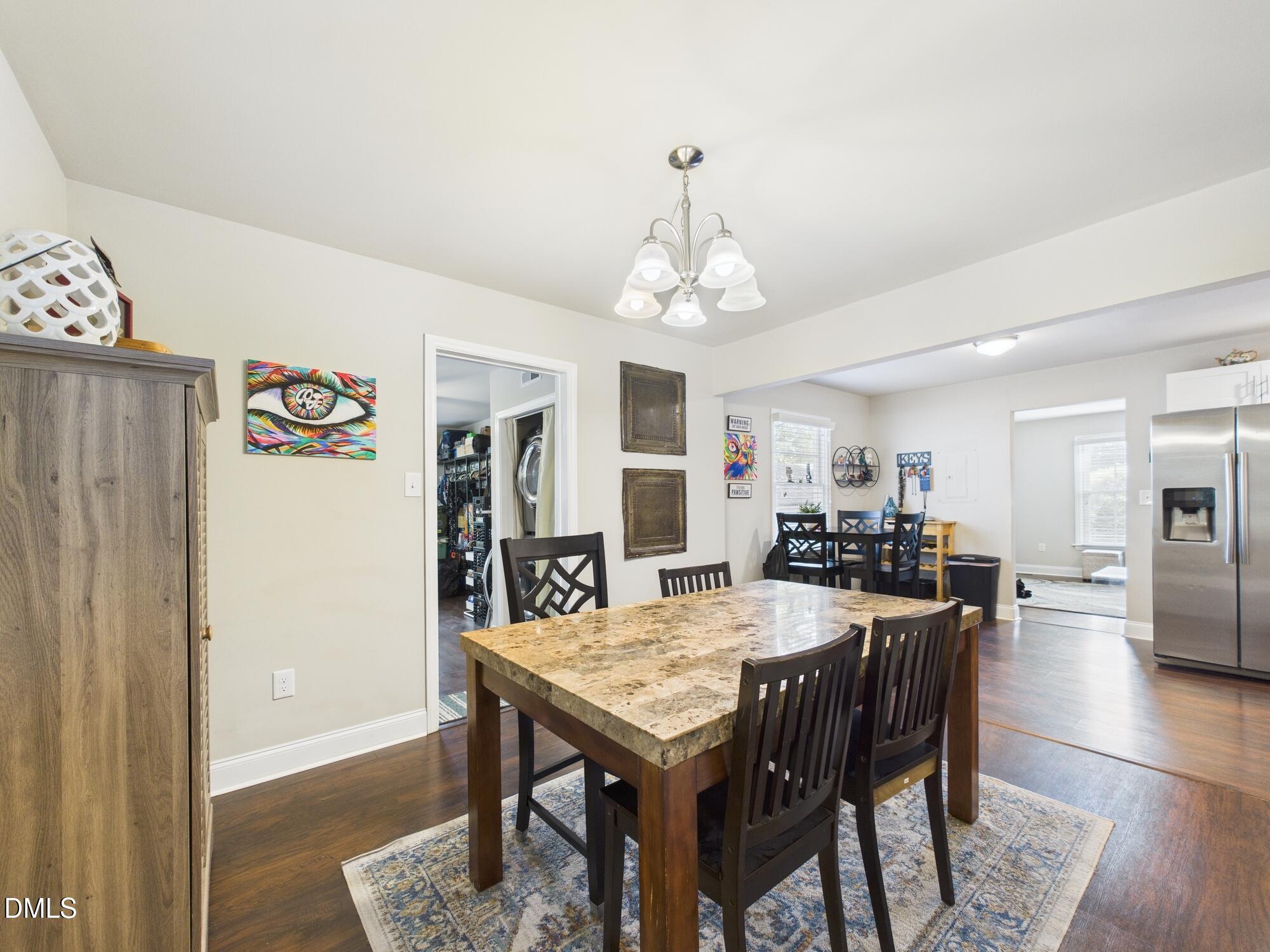 109 Blanchard Street Raleigh, NC 27603 - Photo 23 of 57 a view of a dining room with furniture and wooden floor