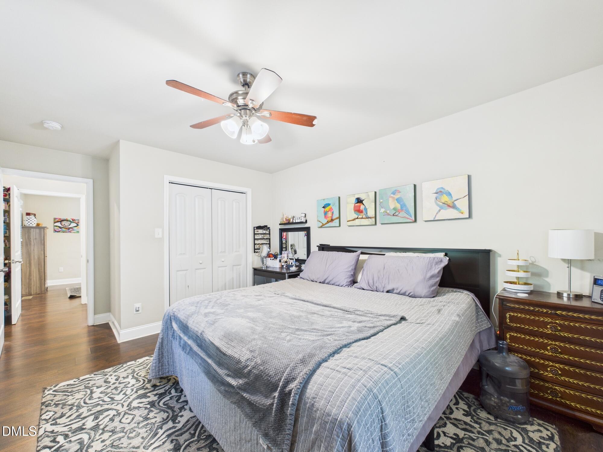 109 Blanchard Street Raleigh, NC 27603 - Photo 25 of 57 a bedroom with a large bed and a chandelier