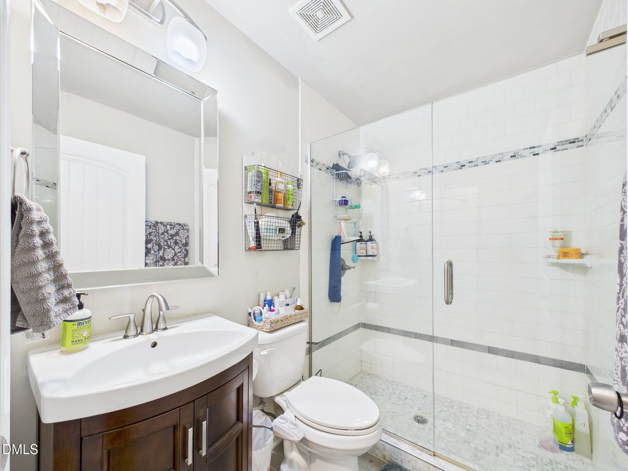 109 Blanchard Street Raleigh, NC 27603 - Photo 27 of 57 a bathroom with a sink toilet and shower