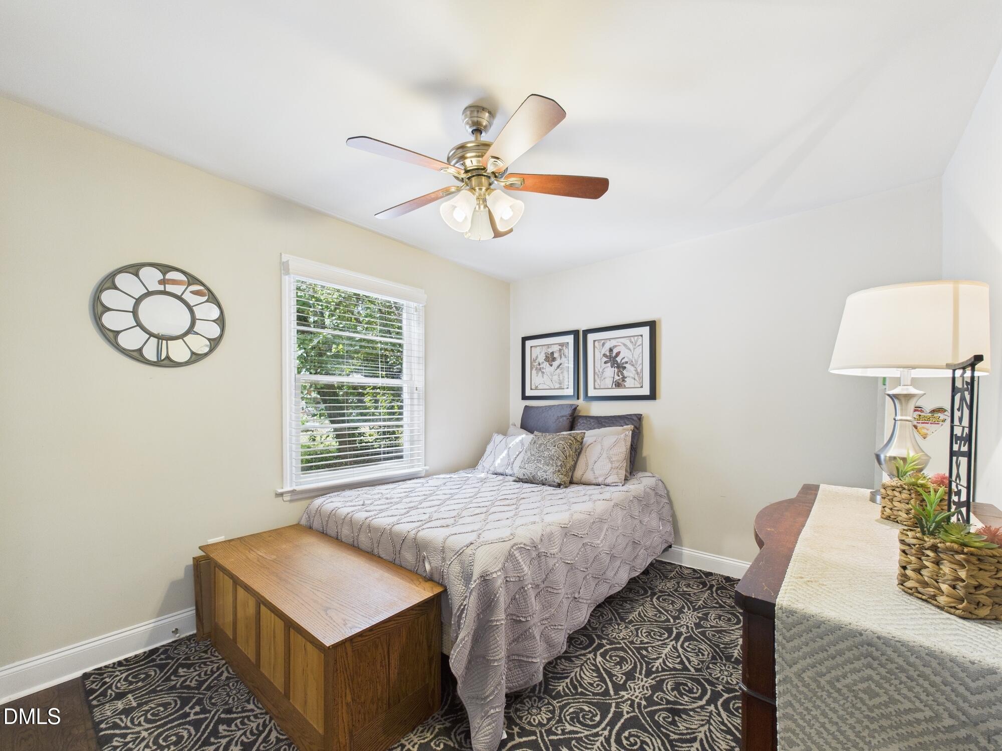 109 Blanchard Street Raleigh, NC 27603 - Photo 28 of 57 a bedroom with a bed and a table