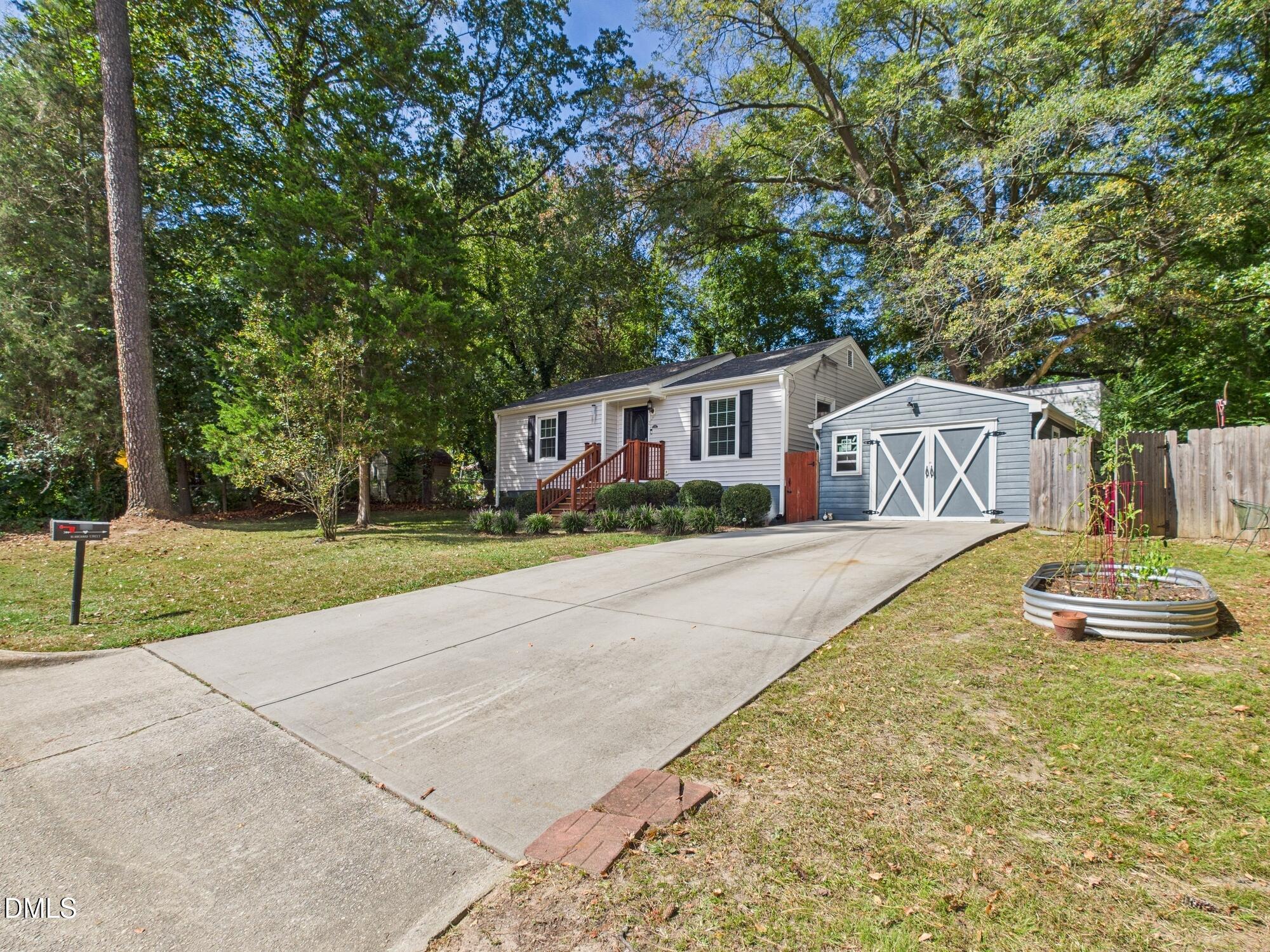 109 Blanchard Street Raleigh, NC 27603 - Photo 3 of 57 a front view of a house with a yard