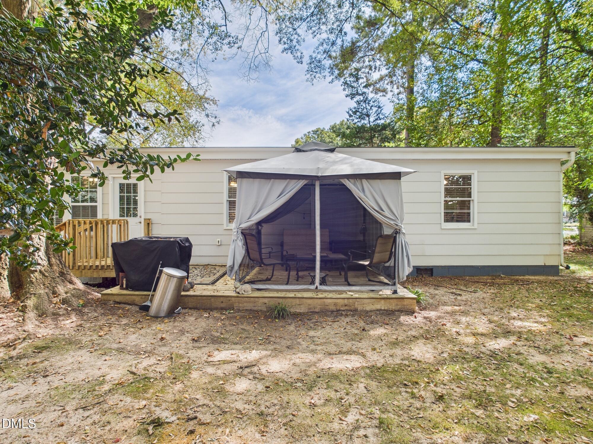 109 Blanchard Street Raleigh, NC 27603 - Photo 42 of 57 a backyard of a house with table and chairs