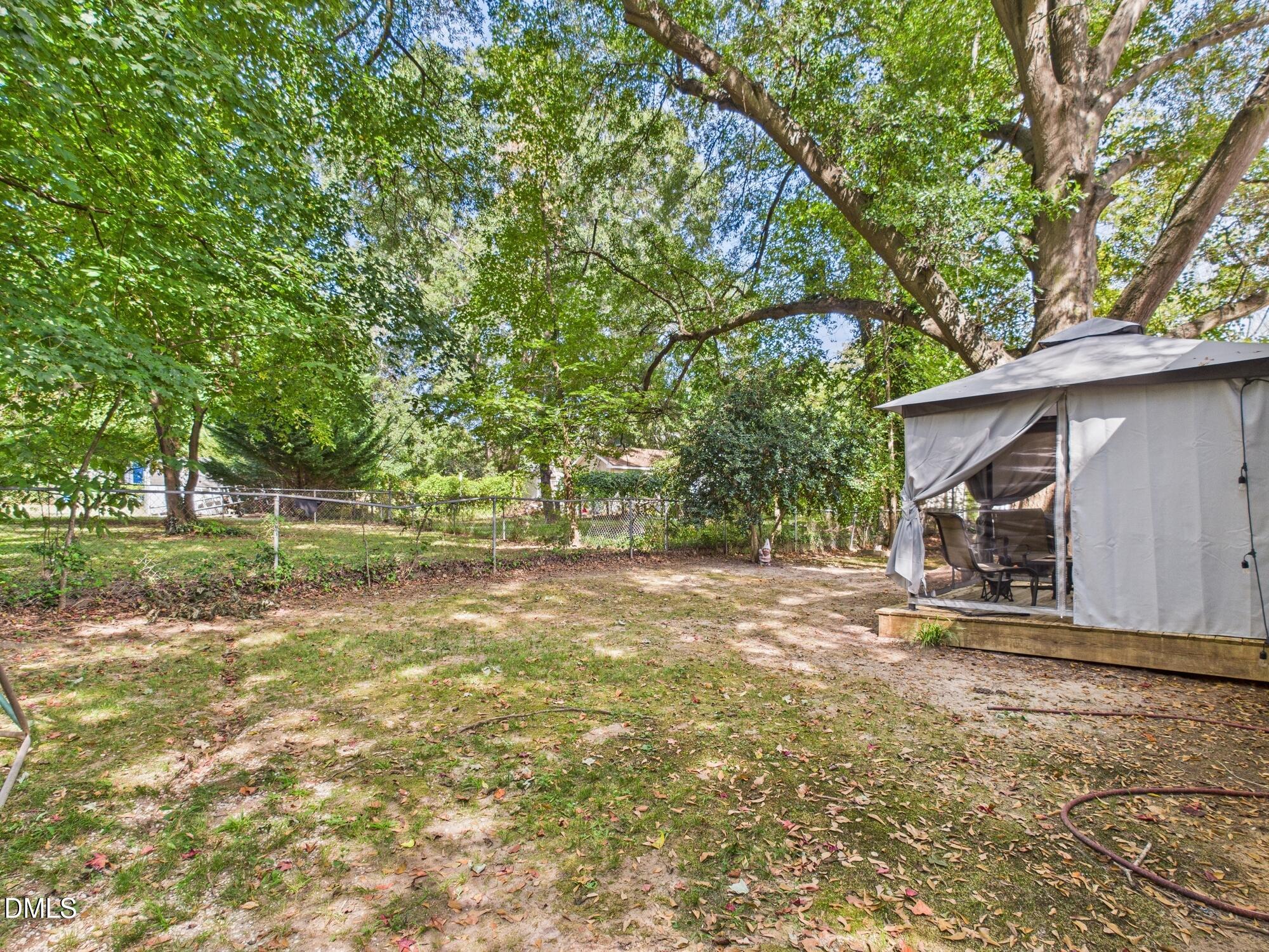 109 Blanchard Street Raleigh, NC 27603 - Photo 44 of 57 a view of a house with a yard