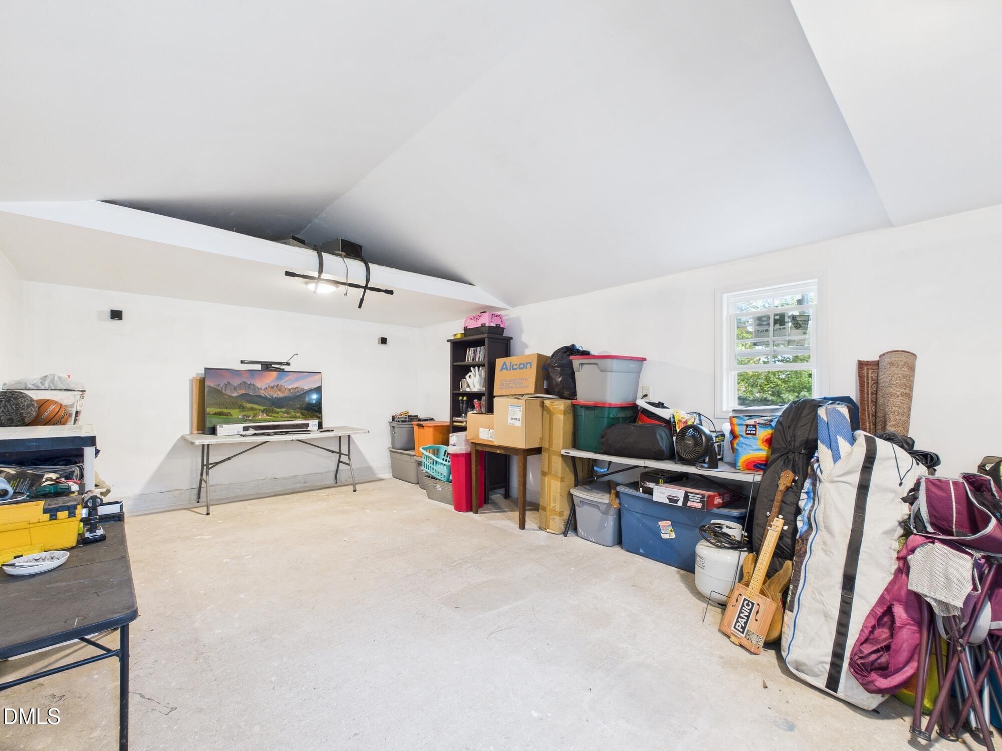 109 Blanchard Street Raleigh, NC 27603 - Photo 54 of 57 a bed room with a bed and a desk