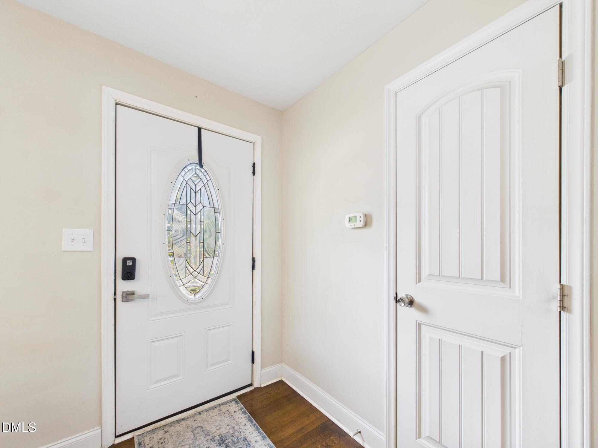 109 Blanchard Street Raleigh, NC 27603 - Photo 7 of 57 a view of front door with wooden door