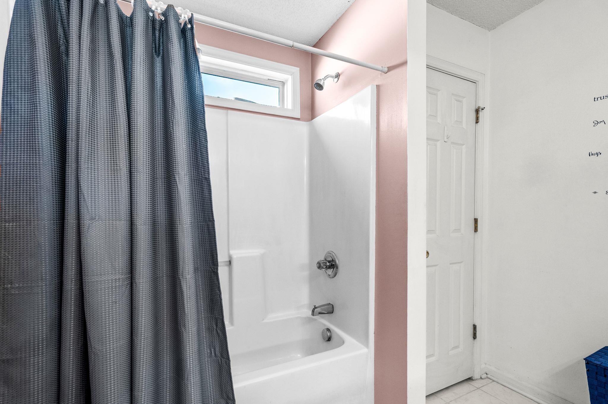 120 Point Break Drive Myrtle Beach, SC 29588 - Photo 28 of 38 Full bathroom with shower / bath combo with shower curtain, tile patterned flooring, and a textured ceiling