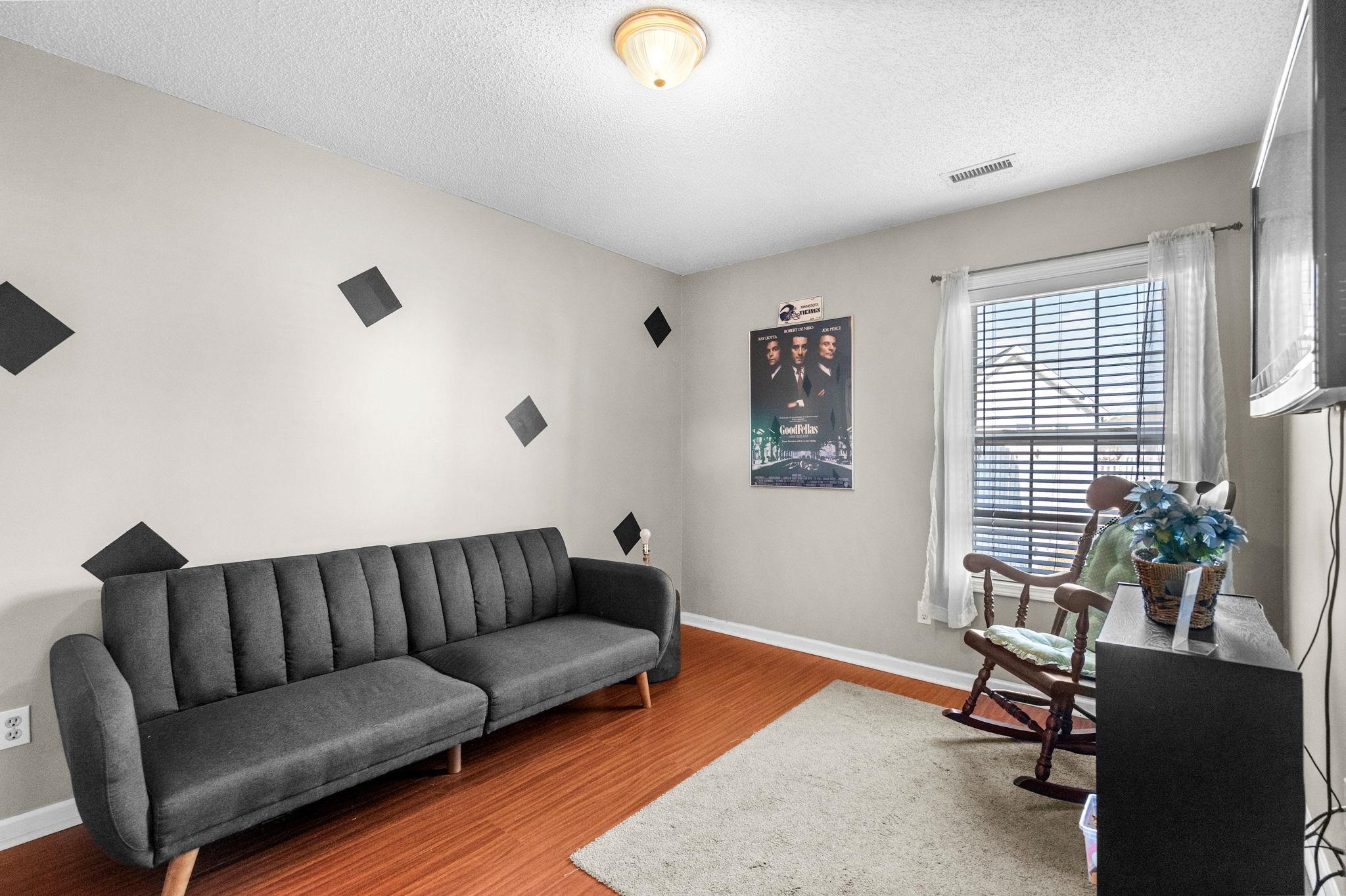 120 Point Break Drive Myrtle Beach, SC 29588 - Photo 31 of 38 Sitting room featuring light wood-type flooring and a textured ceiling