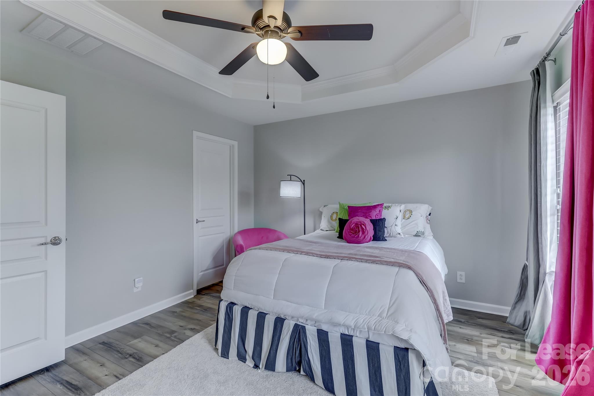 905 Lyndley Drive Fort Mill, SC 29708 - Photo 28 of 42 a bedroom with a bed and a chandelier