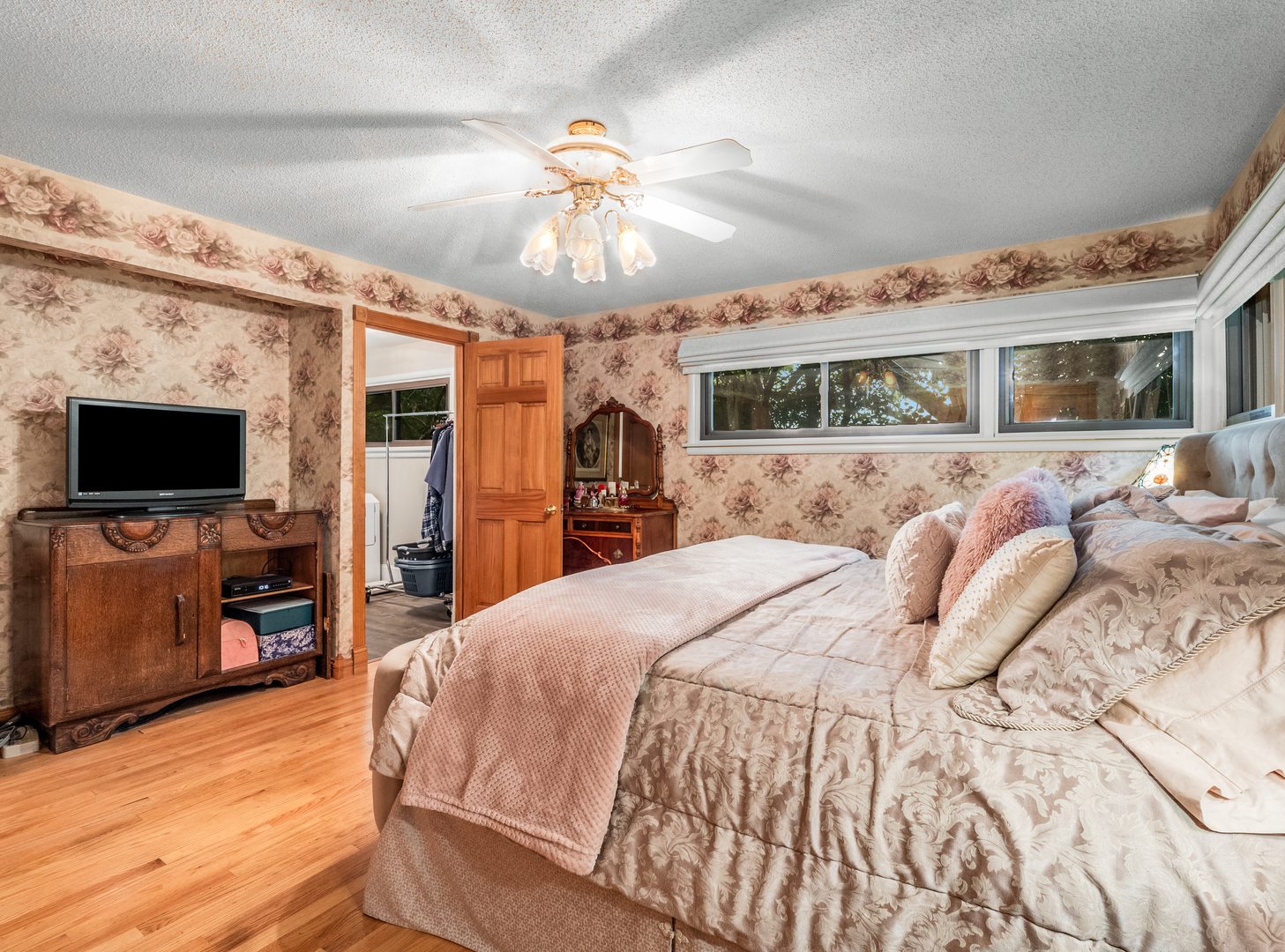 35W249 Country School Road Dundee, IL 60102 - Photo 14 of 23 a spacious bedroom with a bed and a flat screen tv