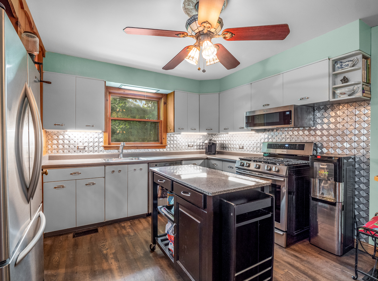 35W249 Country School Road Dundee, IL 60102 - Photo 8 of 23 a kitchen with stainless steel appliances granite countertop a stove a sink dishwasher and a refrigerator