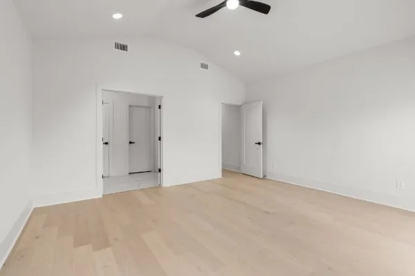 a bathroom with double sink and two mirror