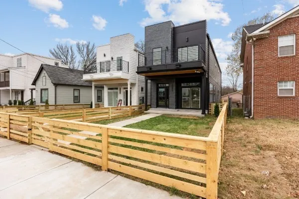 a view of a white building with a large windows