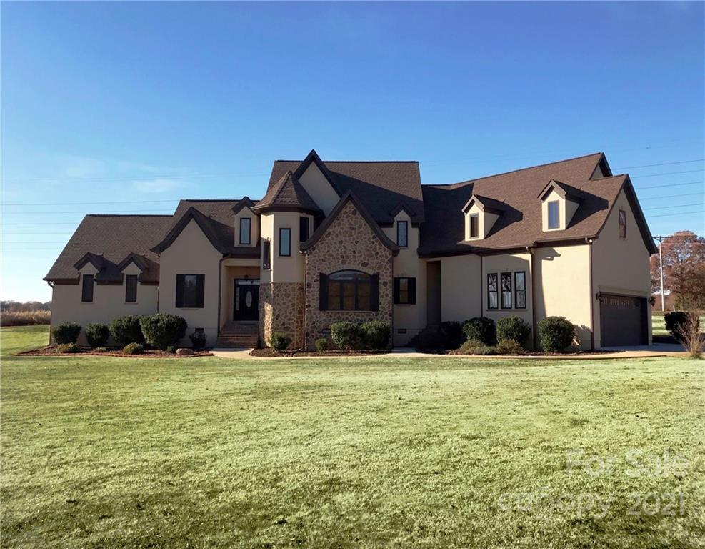 3822 Zebulon Williams Road Monroe, NC 28110 - Photo 1 of 36 a front view of a house with a yard