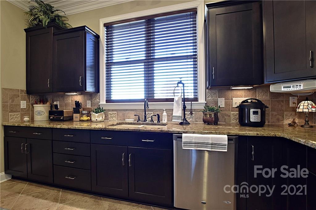 3822 Zebulon Williams Road Monroe, NC 28110 - Photo 12 of 36 a kitchen with a sink and a cabinets