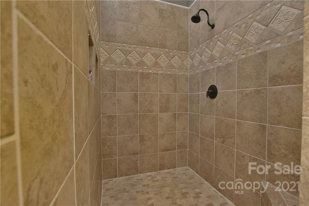 3822 Zebulon Williams Road Monroe, NC 28110 - Photo 19 of 36 a bathroom with a shower