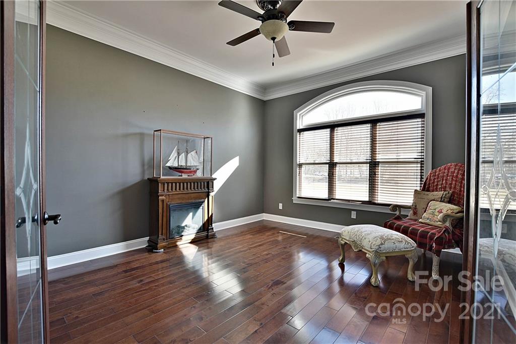 3822 Zebulon Williams Road Monroe, NC 28110 - Photo 20 of 36 a view of a livingroom with furniture and a ceiling fan
