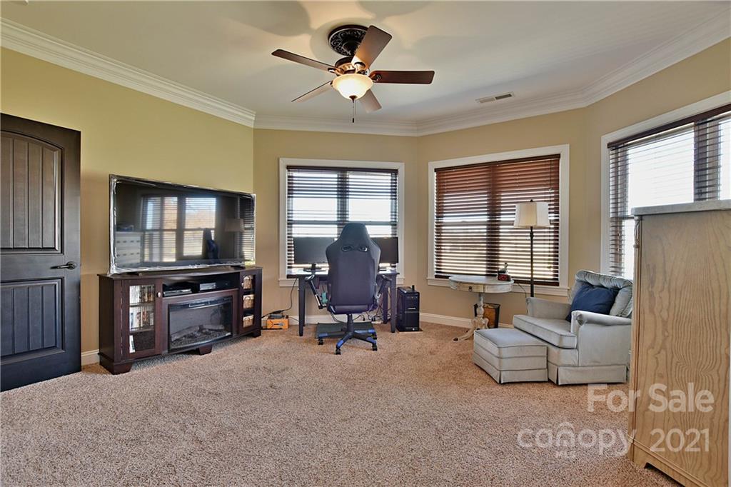 3822 Zebulon Williams Road Monroe, NC 28110 - Photo 23 of 36 a living room with furniture and a flat screen tv