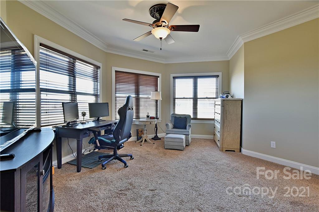 3822 Zebulon Williams Road Monroe, NC 28110 - Photo 24 of 36 a view of a workspace with furniture and a window