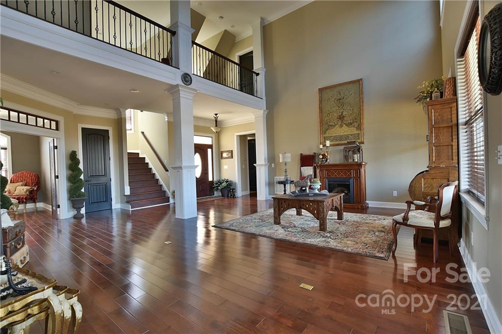 3822 Zebulon Williams Road Monroe, NC 28110 - Photo 4 of 36 a view of a livingroom with furniture wooden floor and a table