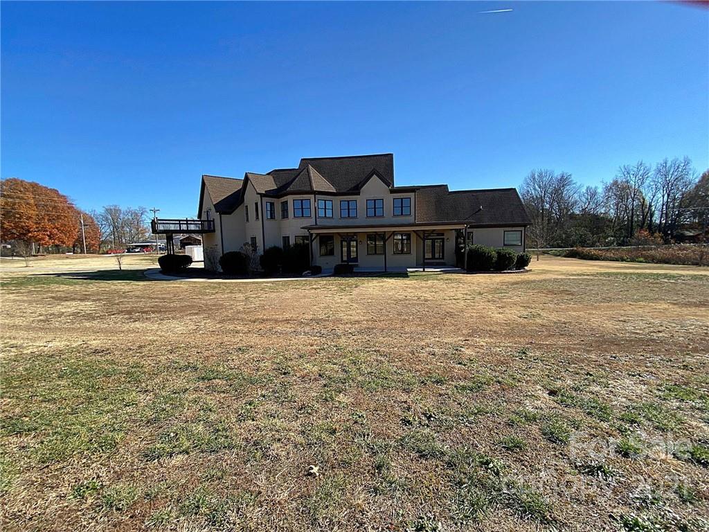 3822 Zebulon Williams Road Monroe, NC 28110 - Photo 35 of 36 a view of a house with a yard