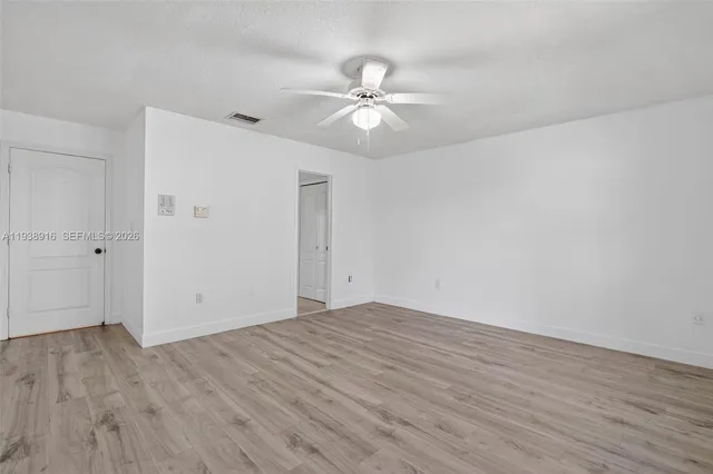 a bathroom with a double vanity sink mirror and toilet