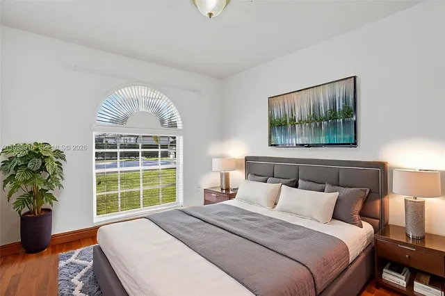 a view of a bathroom with wooden floor