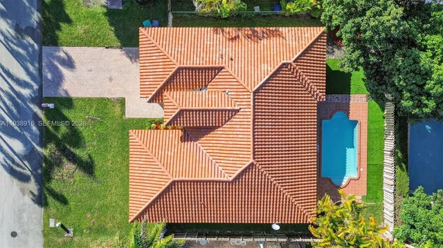 a view of a house with a tree