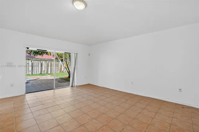 a view of a dining room with furniture wooden floor and chandelier