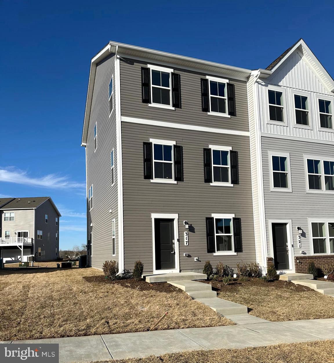 a front view of a house with yard