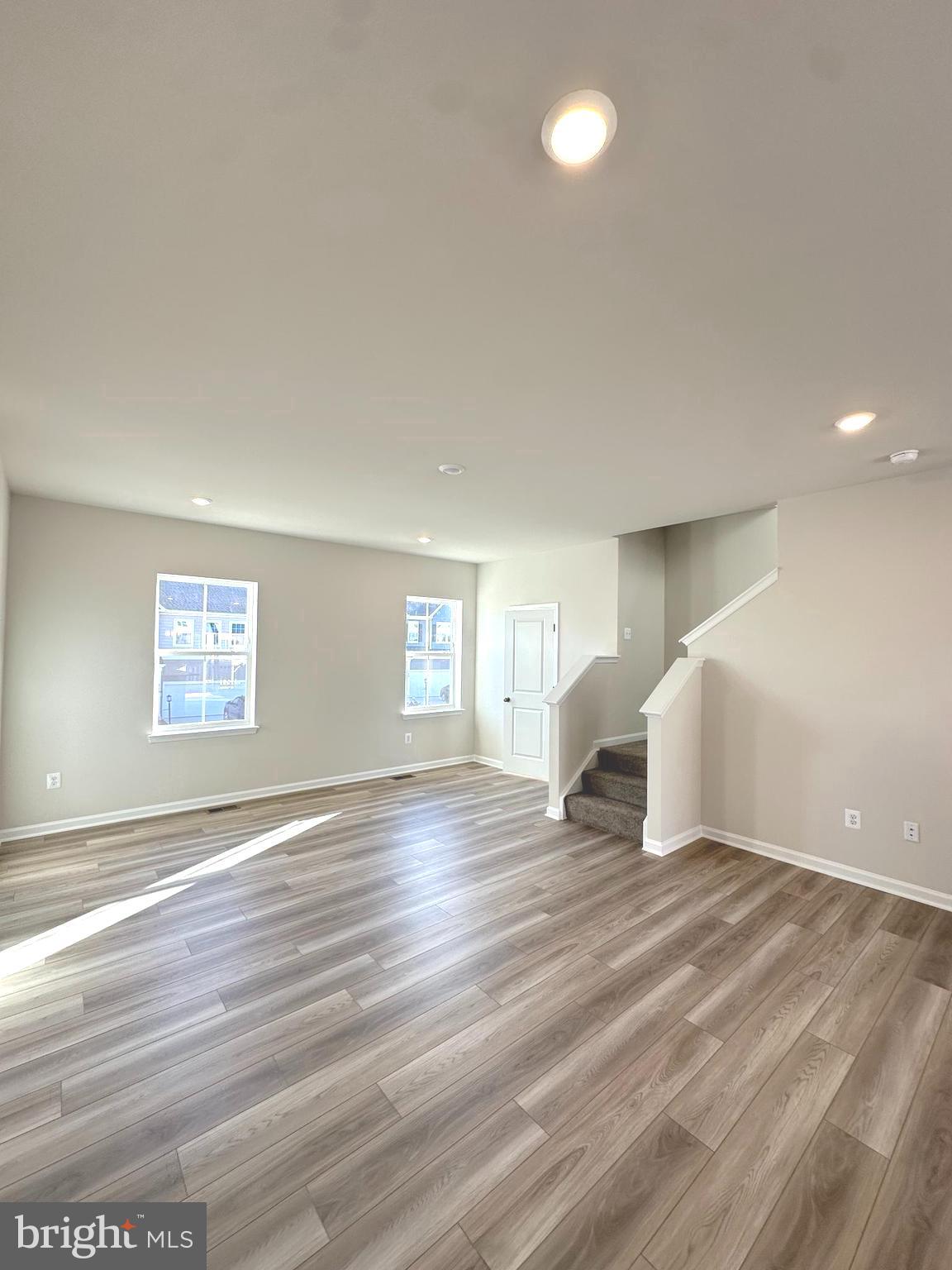317 Short Br Drive Ranson, WV 25438 - Photo 22 of 41 an empty room with wooden floor and windows