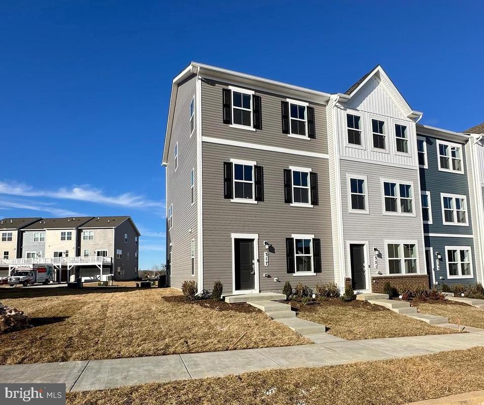 317 Short Br Drive Ranson, WV 25438 - Photo 3 of 41 a front view of a house with a yard
