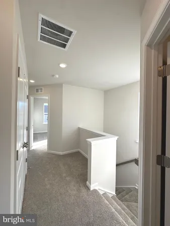 a view of front door with wooden floor