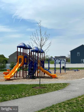 a view of a park with swings and slides