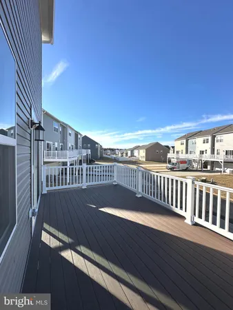 a view of balcony with wooden floor