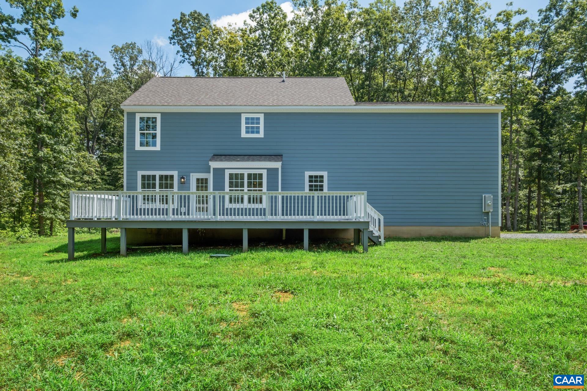 2211 Carpenters Mill Road Ruckersville, VA 22968 - Photo 25 of 25 a view of a house with a yard and deck